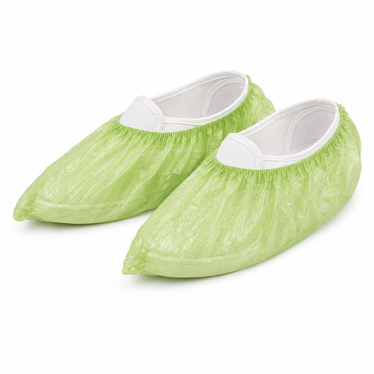 Two green PLA/PBAT shoe covers photographed on white
