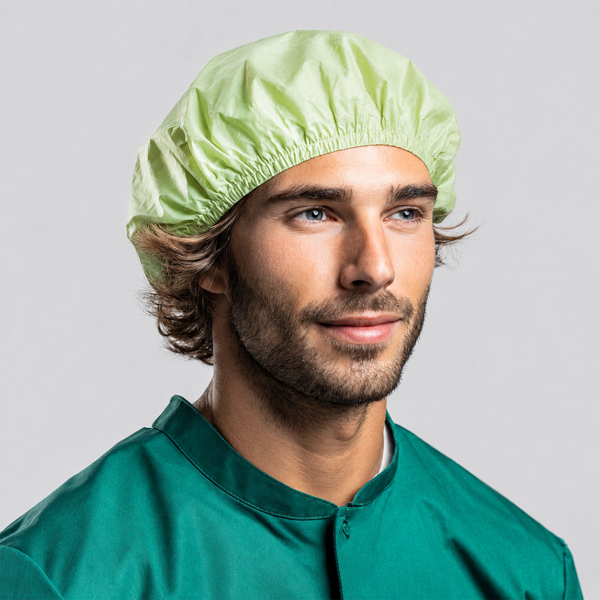 Worker wearing a 22-inch light green PLA/PBAT microporous bouffant cap