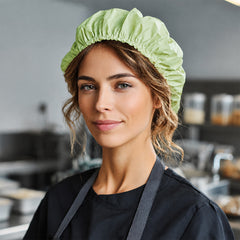 Food packaging worker wearing a 22-inch PLA/PBAT bouffant cap