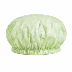 22-inch 65 gsm light green PLA/PBAT microporous bouffant cap on white background