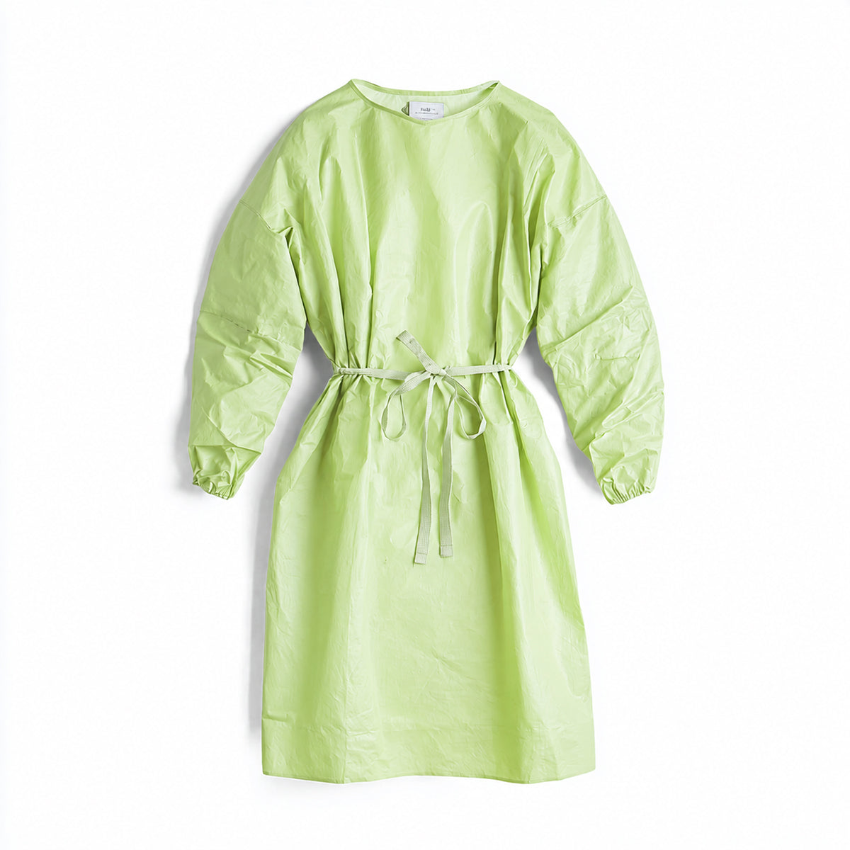 Green disposable isolation gown with waist ties on white