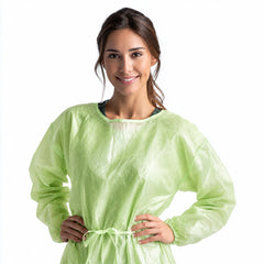 Green isolation gown with elastic cuffs and waist tie on wearer