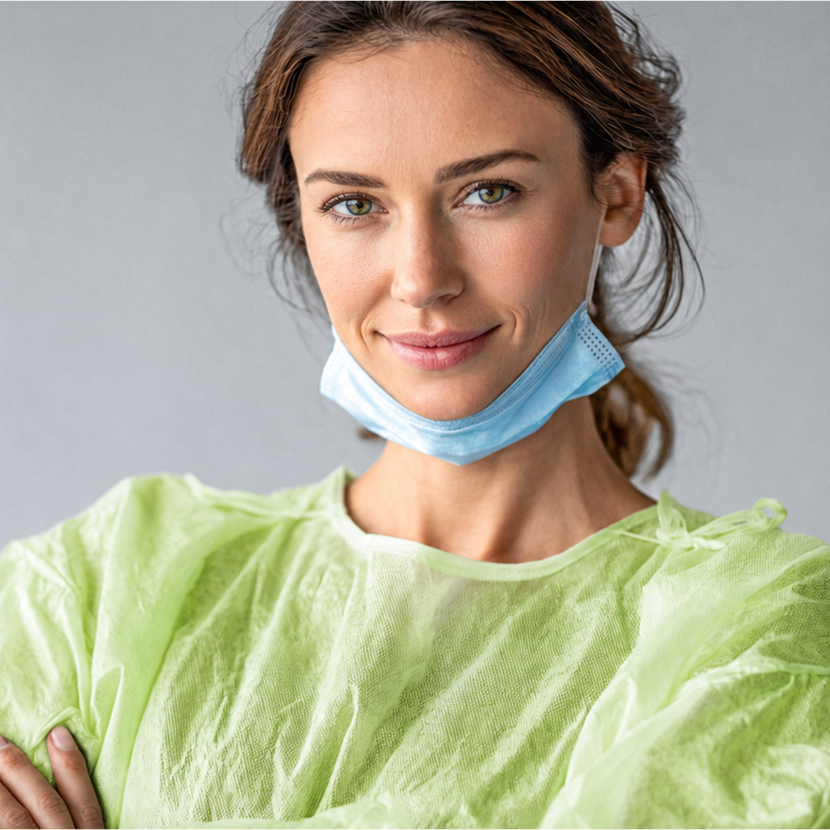 Green PLA/PBAT isolation gown upper-body fit detail