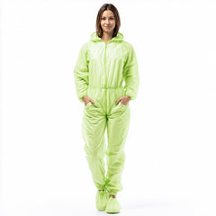 Person wearing green hooded disposable coverall on white