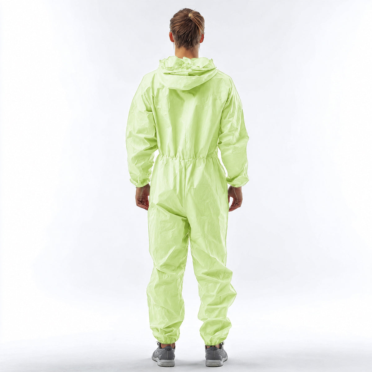 Back fit view of green hooded disposable coverall
