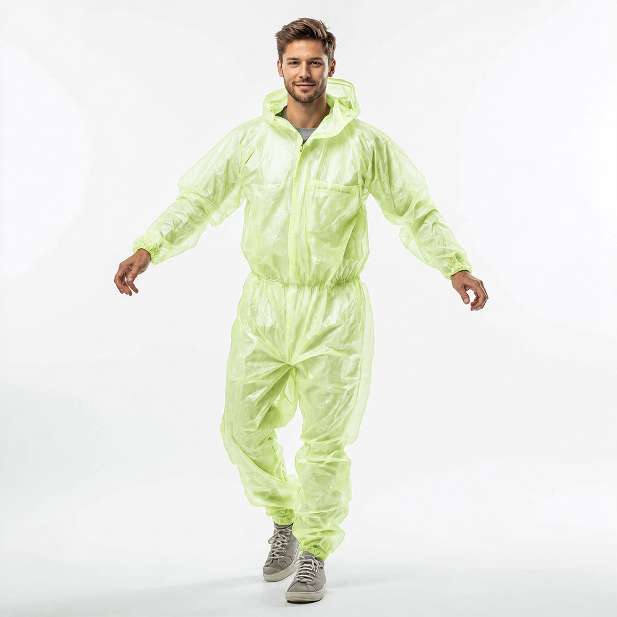 Person walking in green hooded protective coverall