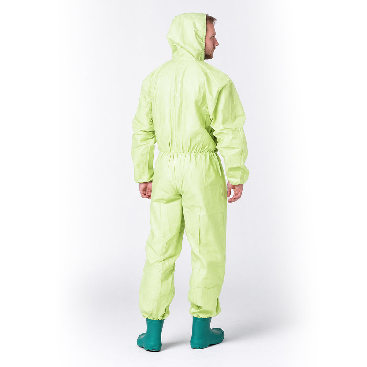 Side fit view of green disposable coverall on wearer