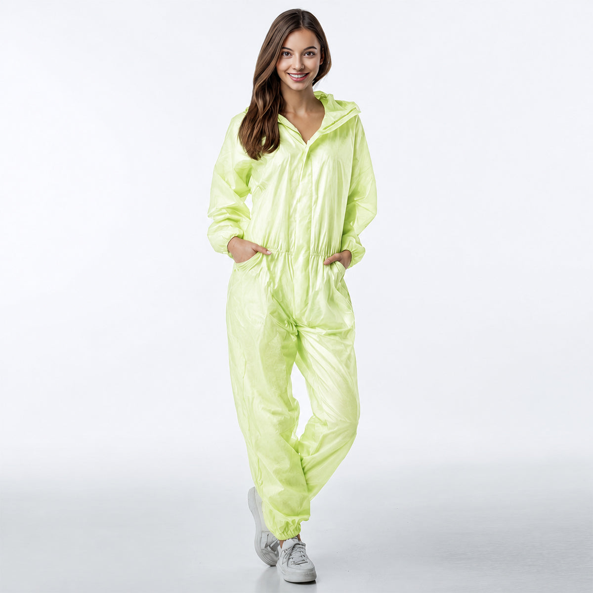 Person wearing green hooded coverall in motion