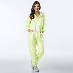 Person wearing green hooded coverall in motion