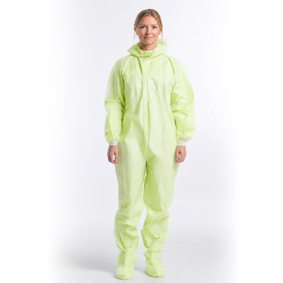 Person wearing green disposable coverall with hood lowered