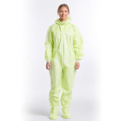 Person wearing green disposable coverall with hood lowered