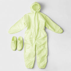Green coverall and matching shoe covers laid flat