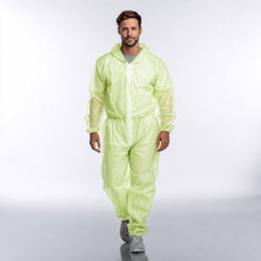 Person wearing green disposable coverall full front view
