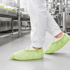 Green shoe covers used for controlled manufacturing support